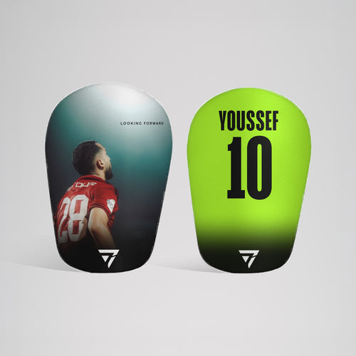 Two Seven custom shin pads: a player photo on one, YOUSSEF 10 on lime on the other
