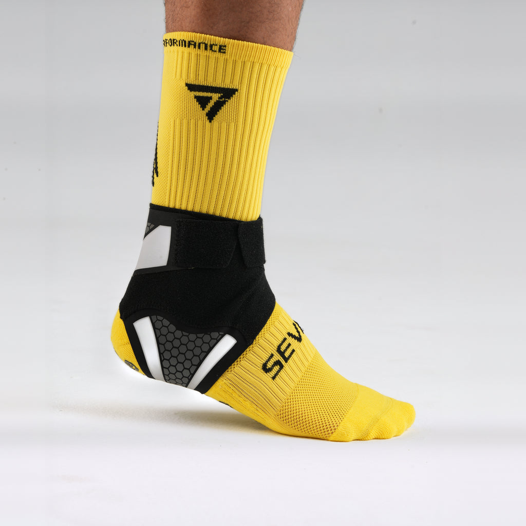 Seven Ankle Support, front three-quarter view showing the strap