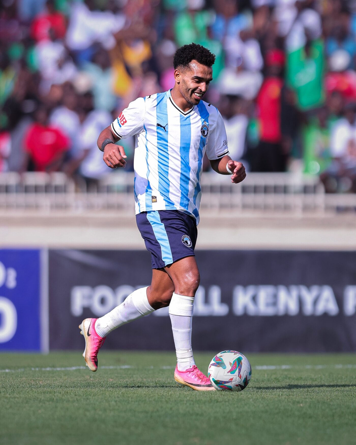 Professional footballer in a league match wearing Seven performance socks under the team socks